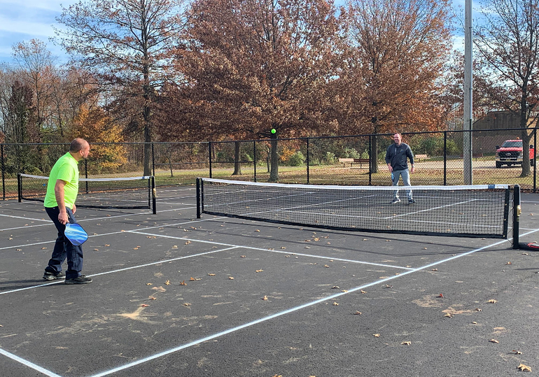 2 mens playing pickleball on New Pickleball Courts Open in Sayreville